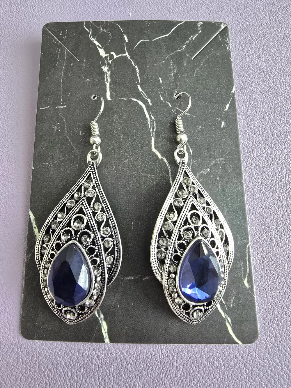 Elegant Silver-Tone Teardrop Earrings with Deep Blue Gem